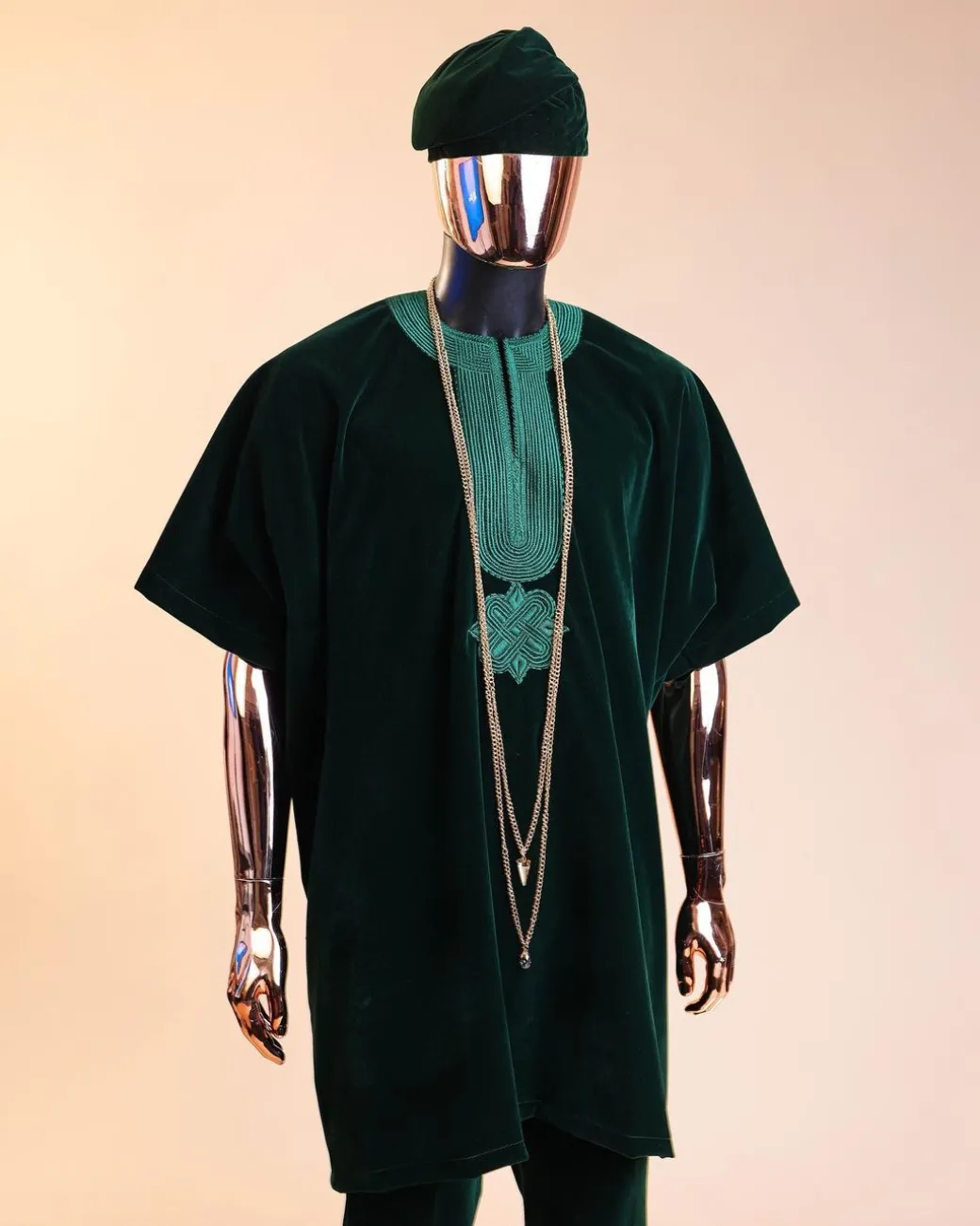 A Sacramento green daftan, sokoto & Fila Yoruba African native.