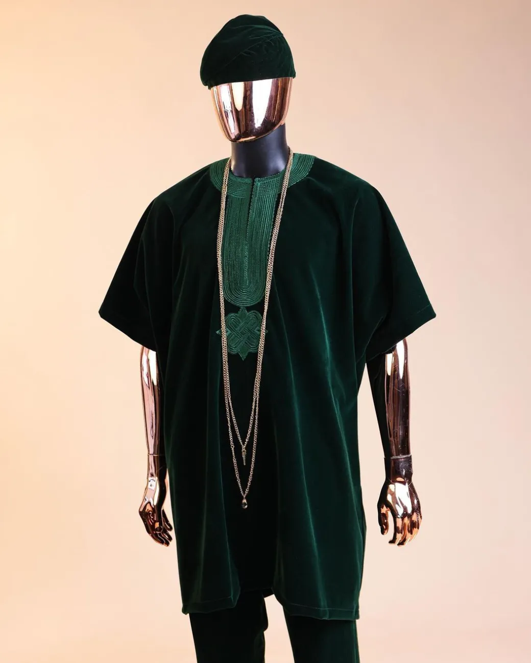 A Sacramento green daftan, sokoto & Fila Yoruba African native.