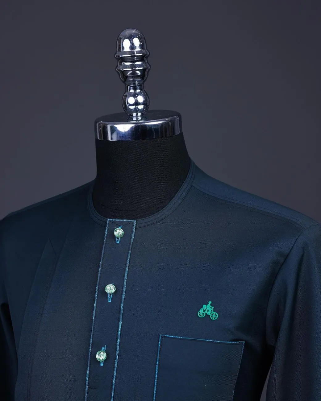 A Sacramento green, Front flap with green Swarovski buttons, patch pocket, 3/4 sleeve details African senator kaftan native.