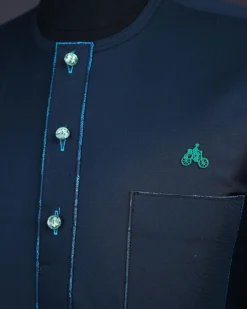 A Sacramento green, Front flap with green Swarovski buttons, patch pocket, 3/4 sleeve details African senator kaftan native.