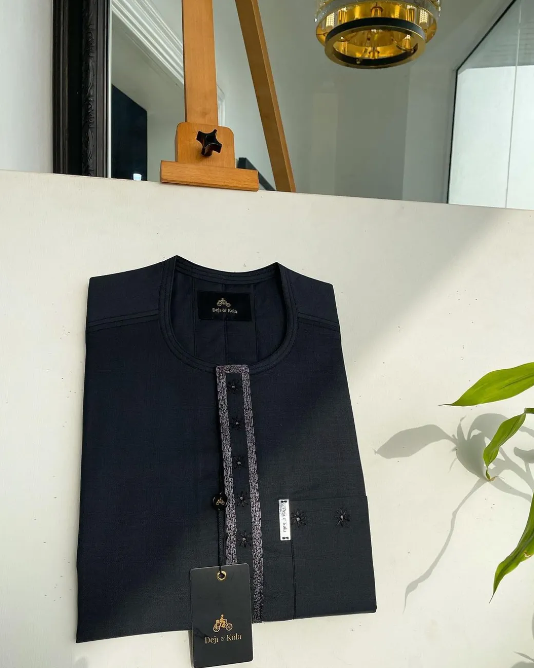 A Sacramento green, rectangle lanes and dotted front flap and pocket embroidery detailing african traditional senator kaftan native.