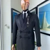 A “sajora” black inverted square patterned jacquard tuxedo suit