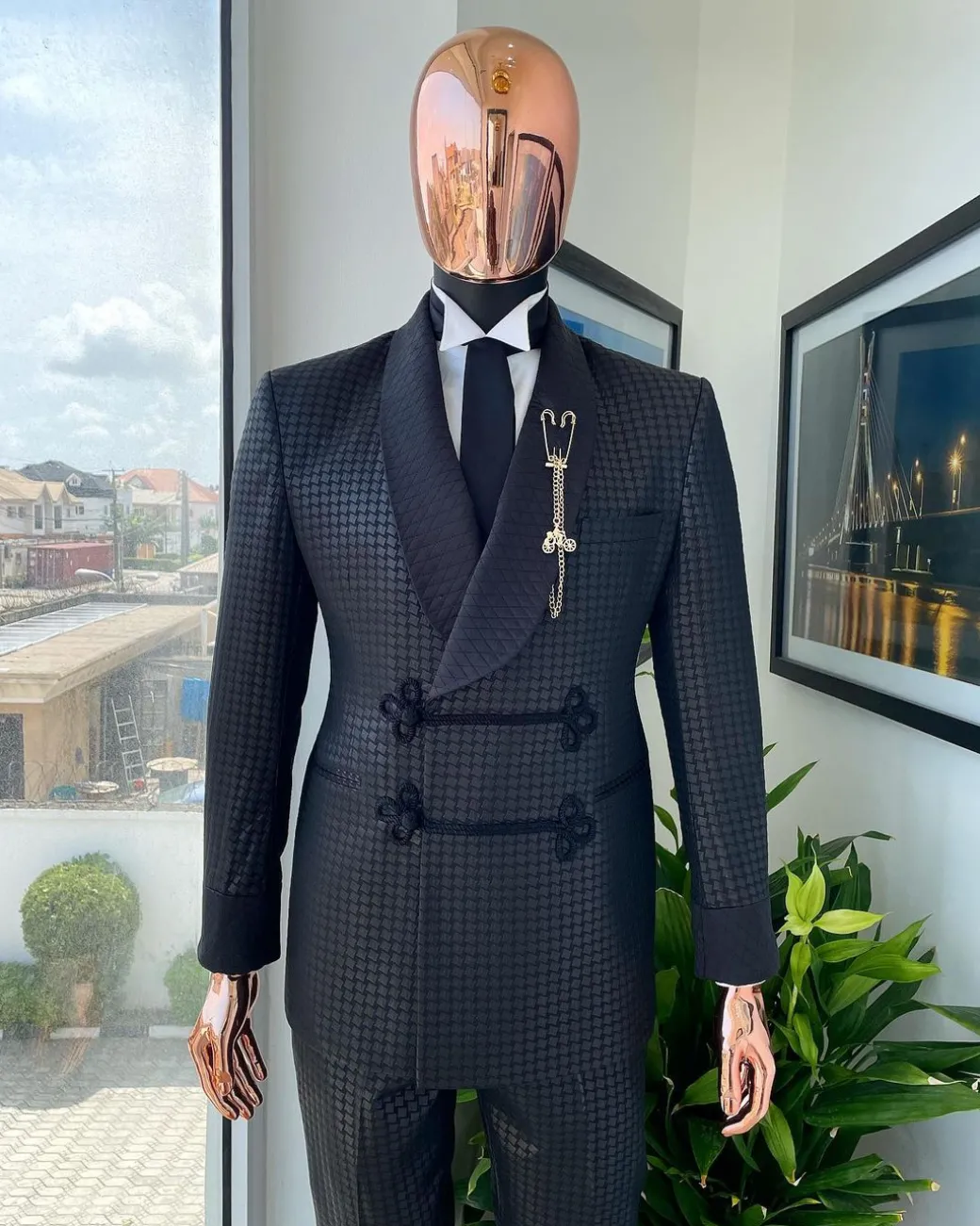 A “sajora” black inverted square patterned jacquard tuxedo suit