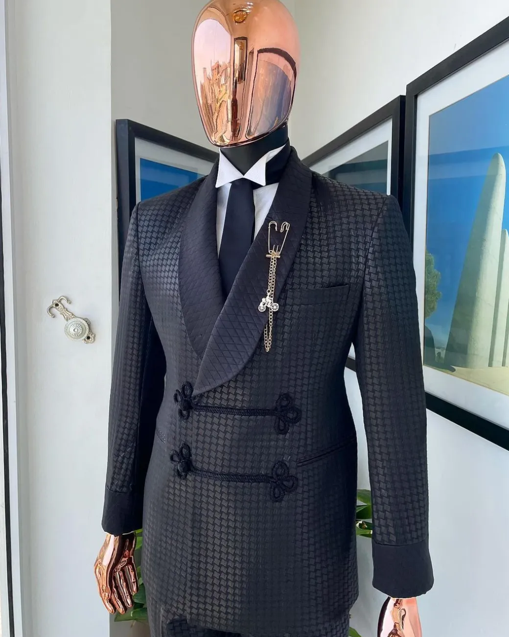 A “sajora” black inverted square patterned jacquard tuxedo suit
