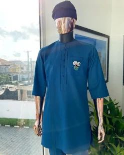A sapphire blue, front flap, embroidery square rectangle flap and pocket design African traditional senator kaftan native.
