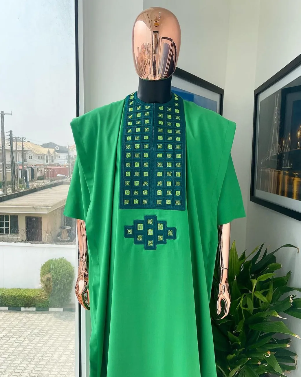 A Shamrock green, connected square embroidery design with matching silver and parakeet green Swarovski stone details agbada