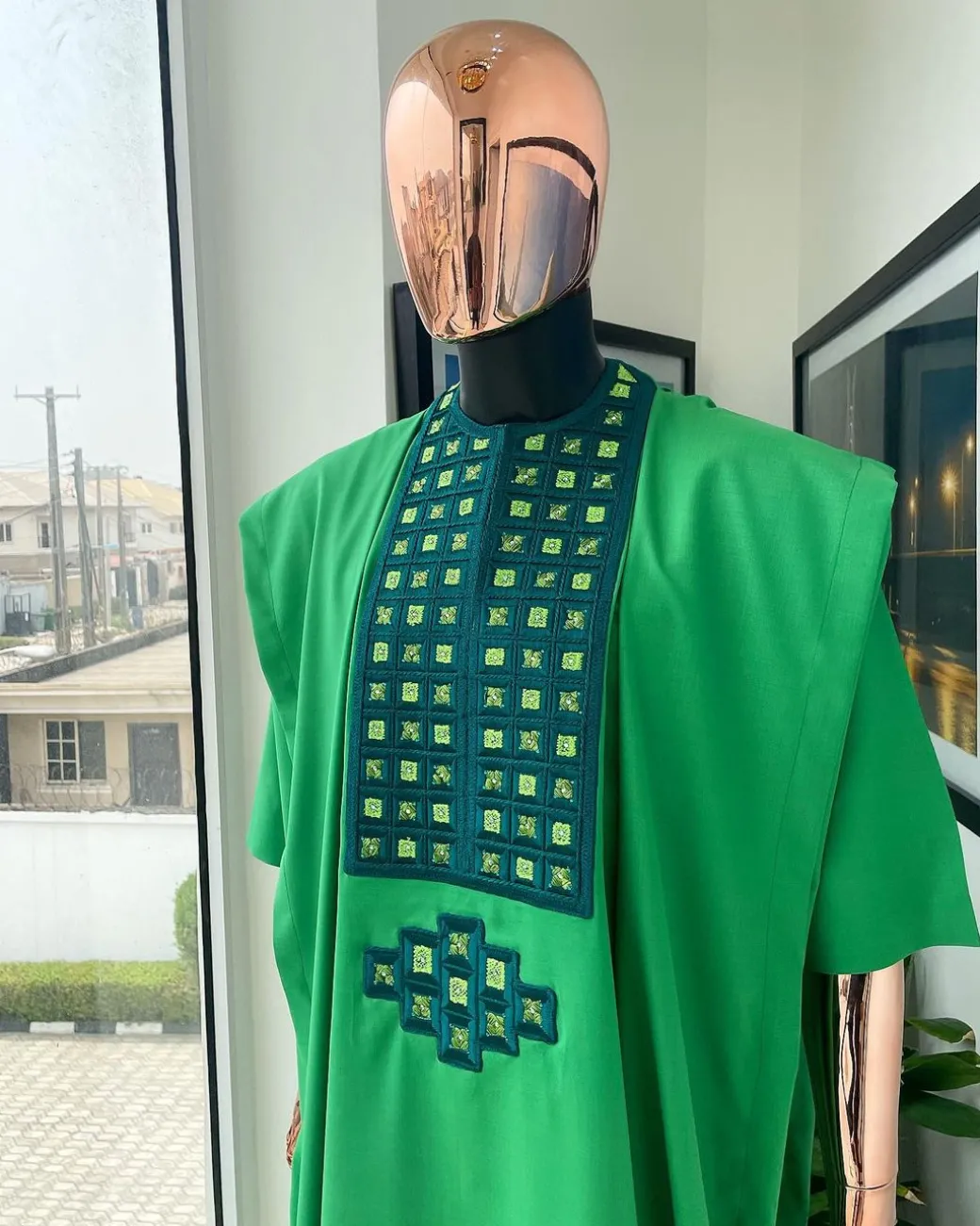 A Shamrock green, connected square embroidery design with matching silver and parakeet green Swarovski stone details agbada