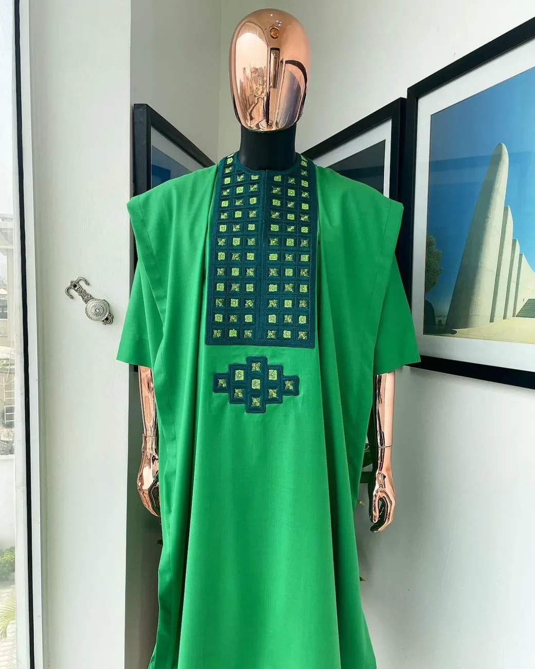 A Shamrock green, connected square embroidery design with matching silver and parakeet green Swarovski stone details agbada