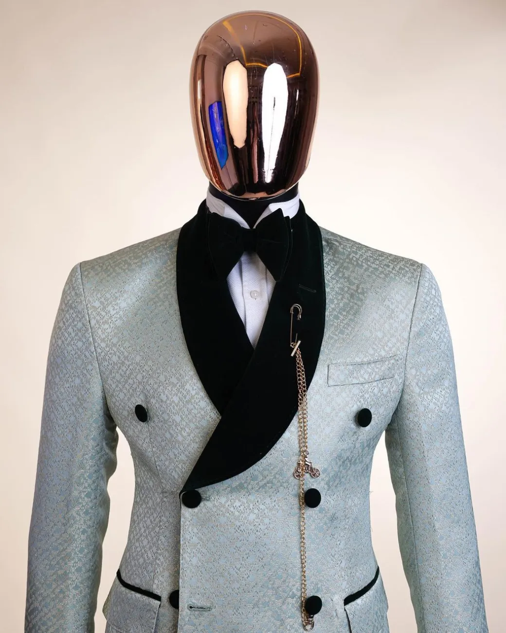 A shawl lapel, Double breathed, pick stitched splashed navy mint green, cream metallic jacquard tuxedo suit