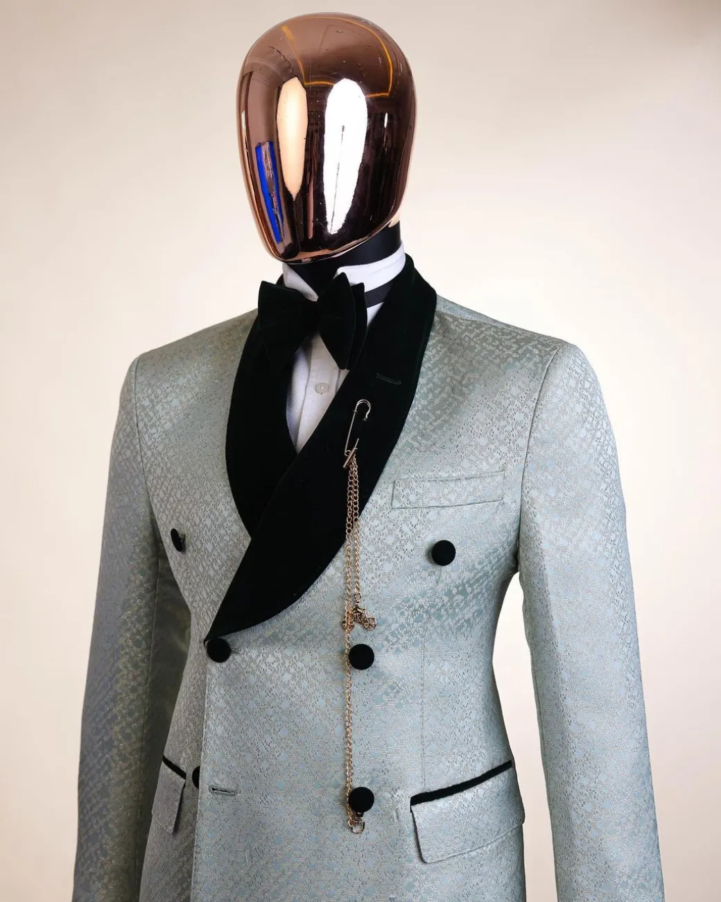 A shawl lapel, Double breathed, pick stitched splashed navy mint green, cream metallic jacquard tuxedo suit