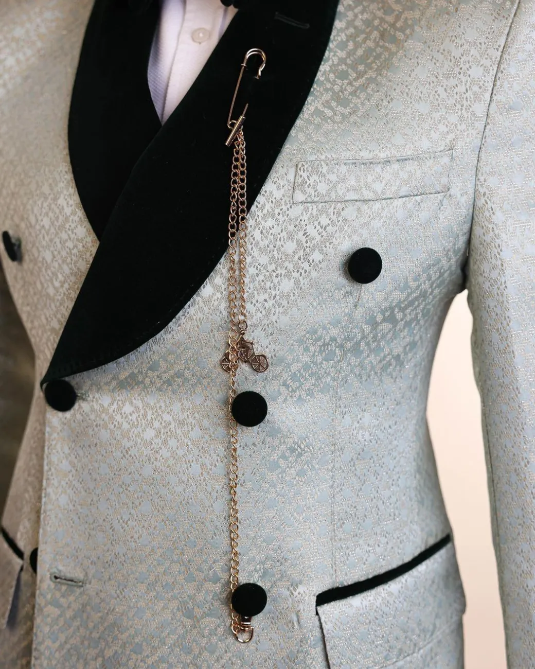 A shawl lapel, Double breathed, pick stitched splashed navy mint green, cream metallic jacquard tuxedo suit