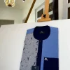 A Skye blue African kaftan with black pearl Swarovski button, paisley detailing and Sokoto
