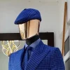 A Skye blue and white check men’s Kangol papas hat.