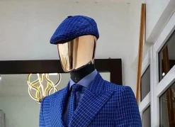 A Skye blue and white check men’s Kangol papas hat.