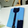 A Skye blue Herringbone fabric kaftan, midnight blue check stripe mix, and matching Swarovski button