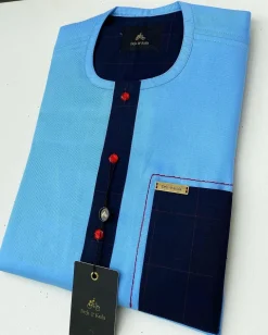 A Skye blue Herringbone fabric kaftan, midnight blue check stripe mix, and matching Swarovski button