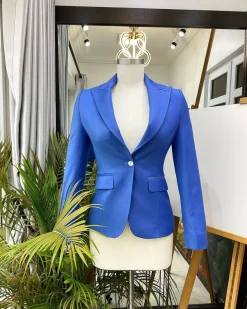 A Skye blue “Lady From Portland” Peak lapel business suit