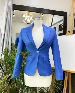 A Skye blue “Lady From Portland” Peak lapel business suit
