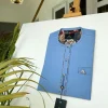 A Skye blue with paisley detailing, front flap with a matching Swarovski button detailing African kaftan and sokoto