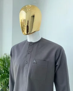 A Space Grey senator with a Swarovski button details African Kaftan