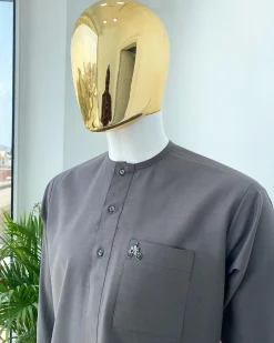 A Space Grey senator with a Swarovski button details African Kaftan