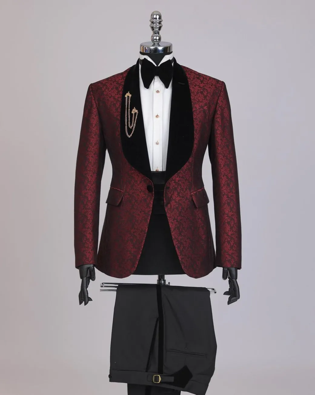 A splash of burgundy and black shawl lapel (black velvet) tuxedo suit