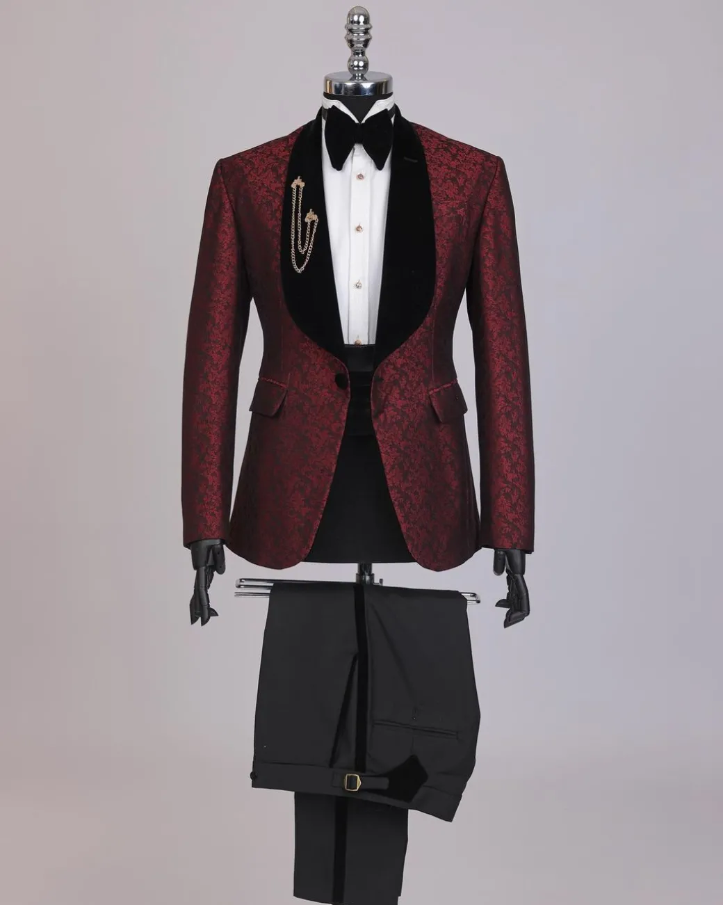 A splash of burgundy and black shawl lapel (black velvet) tuxedo suit