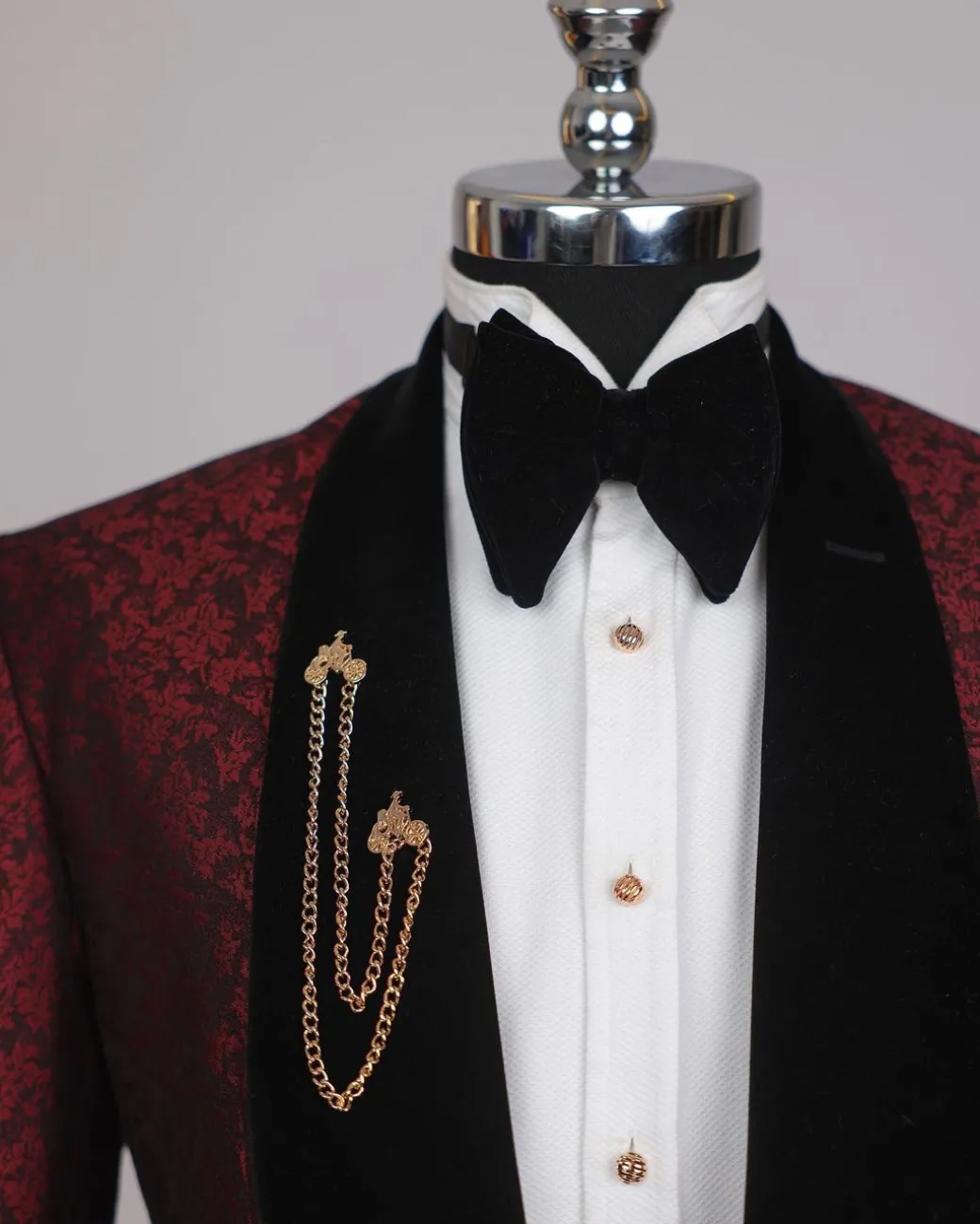 A splash of burgundy and black shawl lapel (black velvet) tuxedo suit