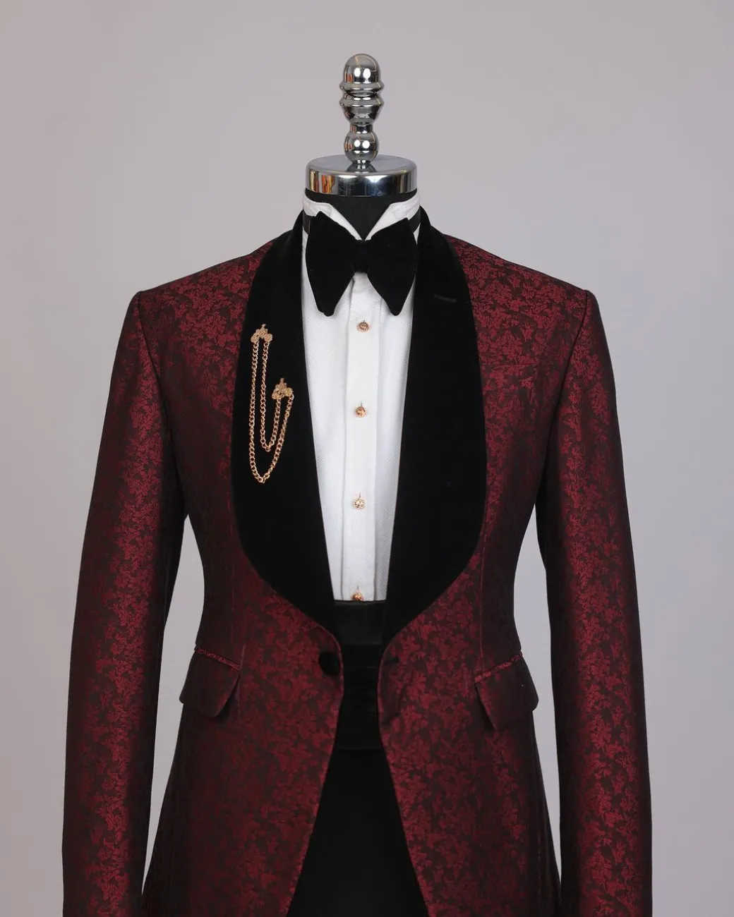 A splash of burgundy and black shawl lapel (black velvet) tuxedo suit