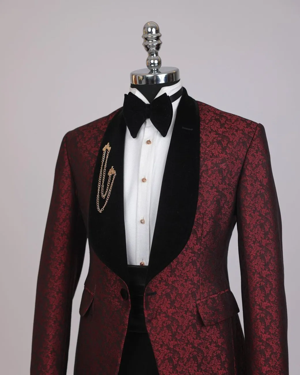 A splash of burgundy and black shawl lapel (black velvet) tuxedo suit
