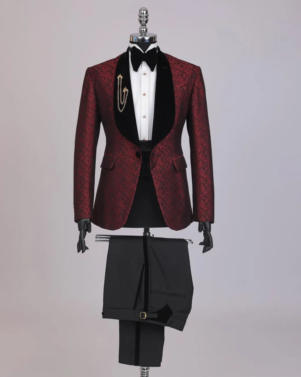 A splash of burgundy and black shawl lapel (black velvet) tuxedo suit
