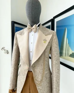 A splash of tortilla and wheat brown peak lapel metallic jacquard tuxedo suit