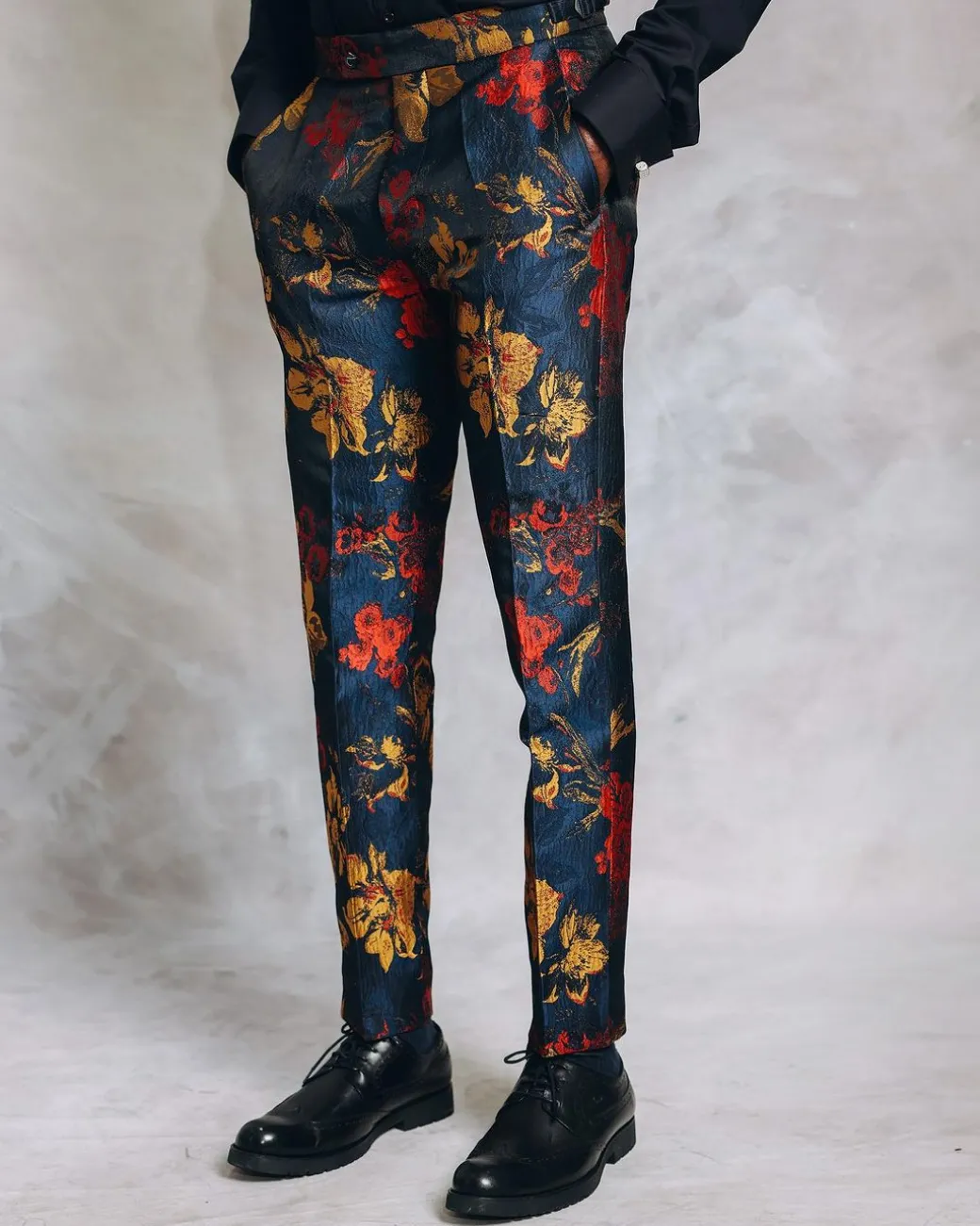 A Splashed Red, Yellow & Blue Floral Jacquard Gurkha Pant With a Side Metal Adjuster.