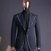 A steel black, seer sucker fabric, knitted, peak lapel suit