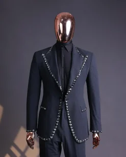 A steel black, seer sucker fabric, knitted, peak lapel suit