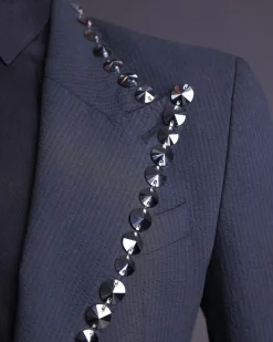 A steel black, seer sucker fabric, knitted, peak lapel suit