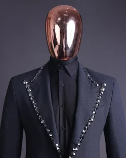 A steel black, seer sucker fabric, knitted, peak lapel suit