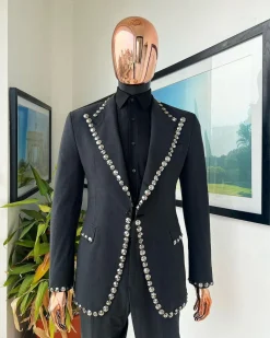 A steel black, seer sucker fabric, knitted, peak lapel suit