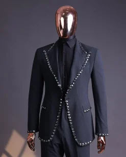 A steel black, seer sucker fabric, knitted, peak lapel suit