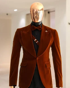 A Syrup Brown, Peak Lapel Tuxedo Suit With An Inner Slant Anchor.