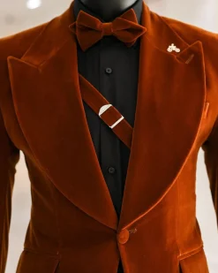 A Syrup Brown, Peak Lapel Tuxedo Suit With An Inner Slant Anchor.