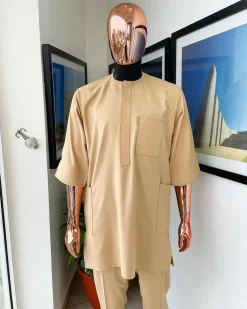A Tan Brown, connected iron drop embroidery design with matching Agbada