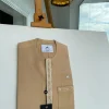 A Tan brown, embroidery front flap, and patch pocket African traditional kaftan native