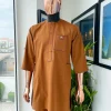A Tawny brown, front flap, patch pocket, matching Swarovski buttons, paisley detailing African senator kaftan native.