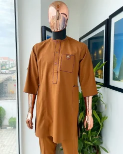 A Tawny brown, front flap, patch pocket, matching Swarovski buttons, paisley detailing African senator kaftan native.