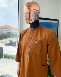 A Tawny brown, front flap, patch pocket, matching Swarovski buttons, paisley detailing African senator kaftan native.