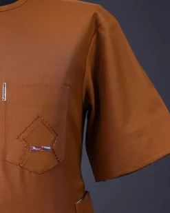 A Tawny brown, Front flap, patch pocket, short sleeve details African senator kaftan native.
