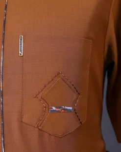 A Tawny brown, Front flap, patch pocket, short sleeve details African senator kaftan native.