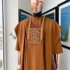A Tawny brown, Medusa Head embroidery detailing Agbada