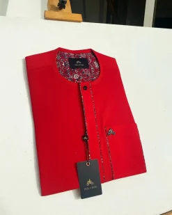 A tomato red flat design senator Kaftan with black Swarovski button African Kaftan